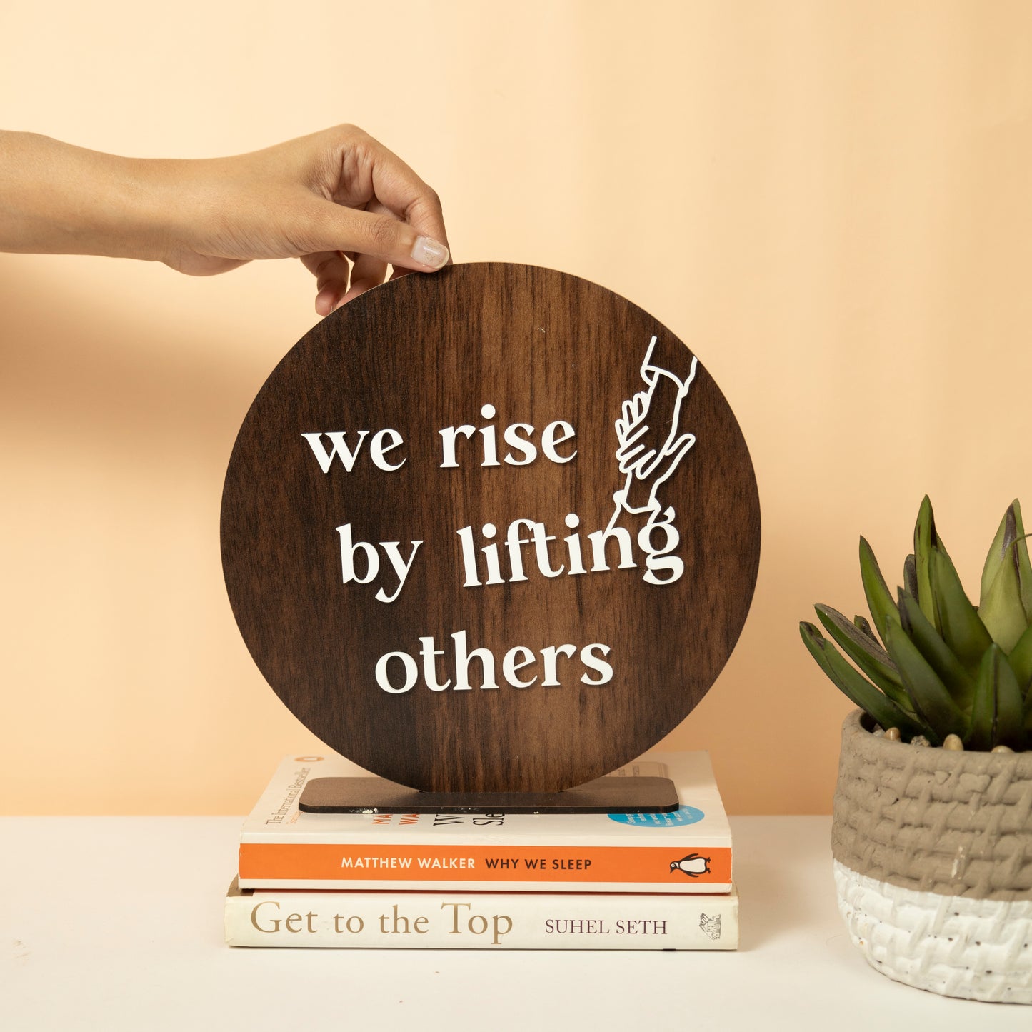 Inspirational Round Wooden Wall Sign – We Rise by Lifting Others