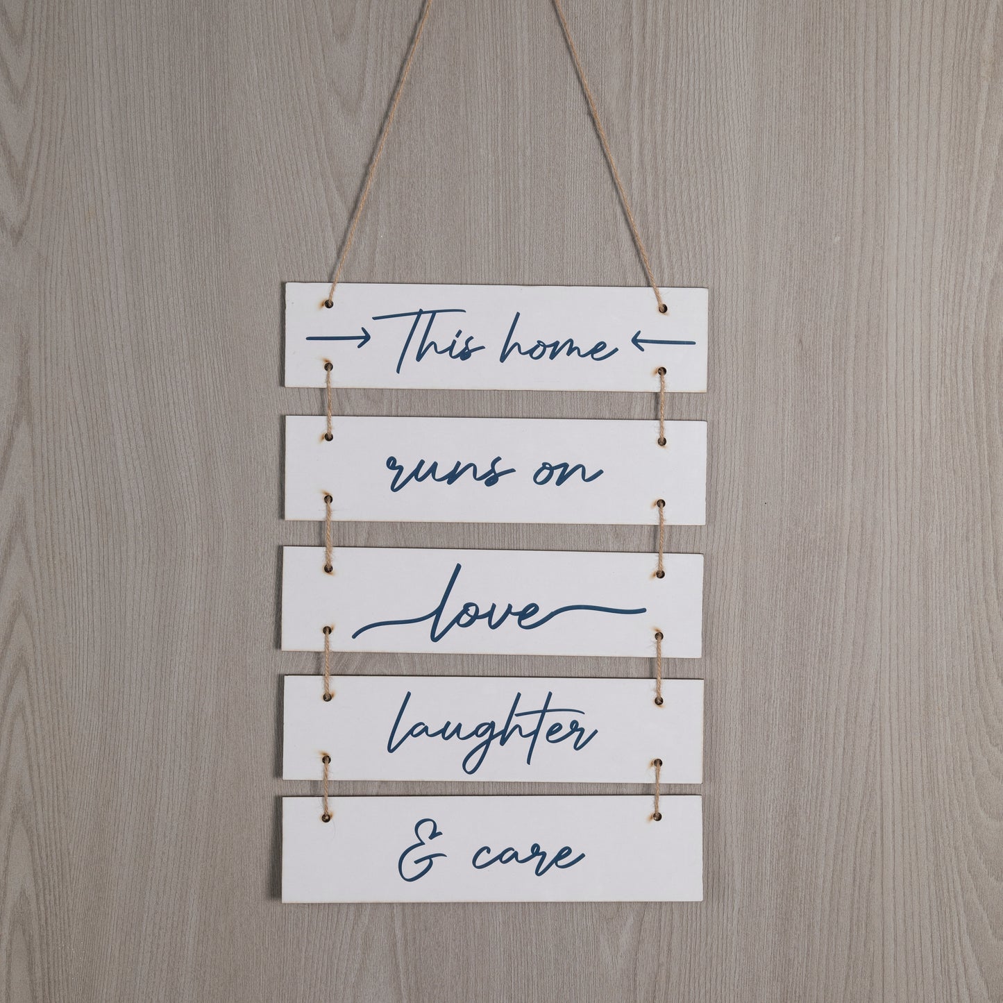 Wooden Hanging Home Sign – This home runs on love, laughter & care